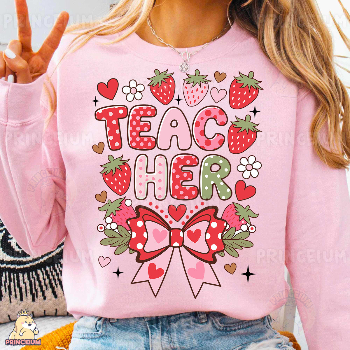 a woman wearing a pink shirt that says teach her