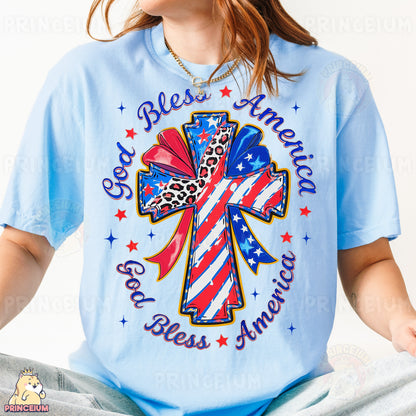 a woman wearing a blue shirt with a cross on it