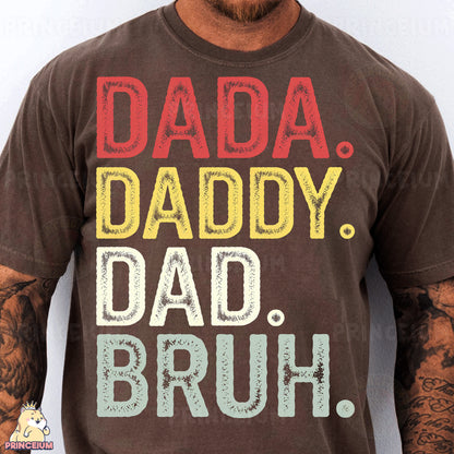 a man wearing a brown shirt with the words dad, daddy, dad, br