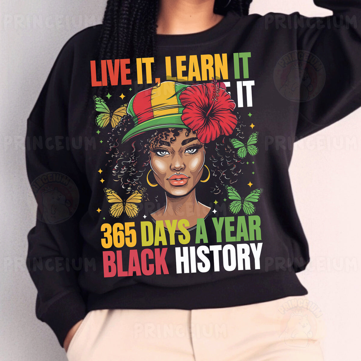a woman wearing a black sweatshirt with a flower on it