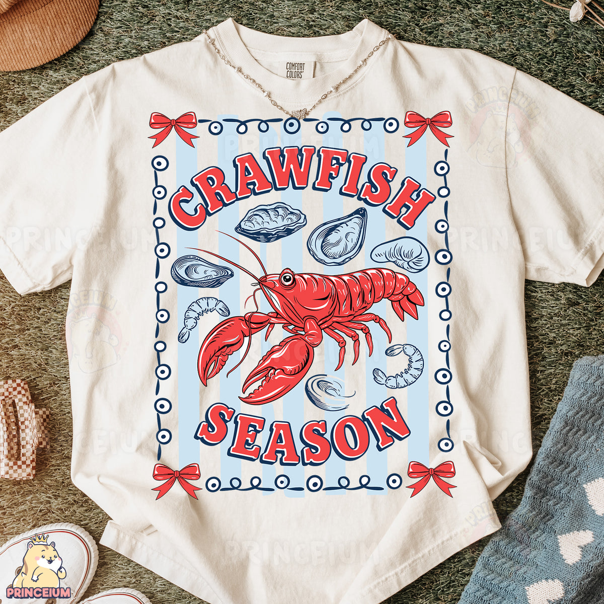 a white t - shirt with a picture of a lobster on it