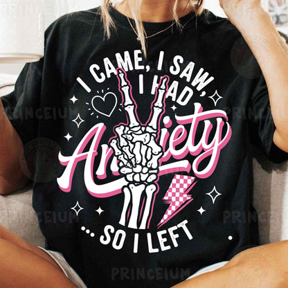 a woman sitting on a couch wearing a t - shirt that says i came i