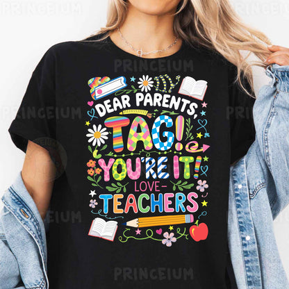 a woman wearing a t - shirt that says dear parents tag you're it