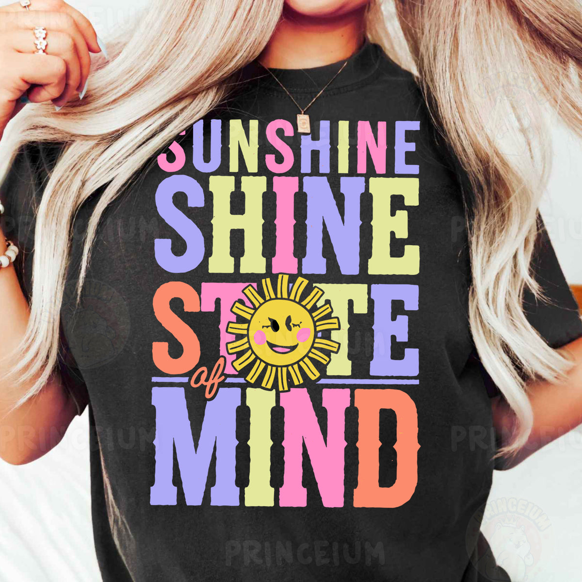 a woman with blonde hair wearing a black sunshine shirt
