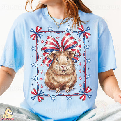 a woman wearing a blue shirt with a picture of a hamster on it