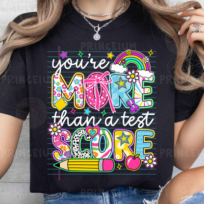 a woman wearing a t - shirt that says you're more than a test