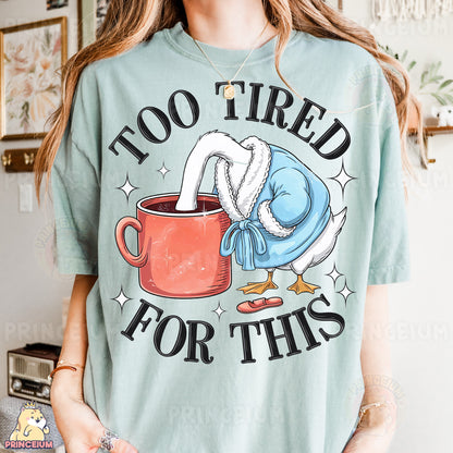 a woman wearing a t - shirt that says too tired for this
