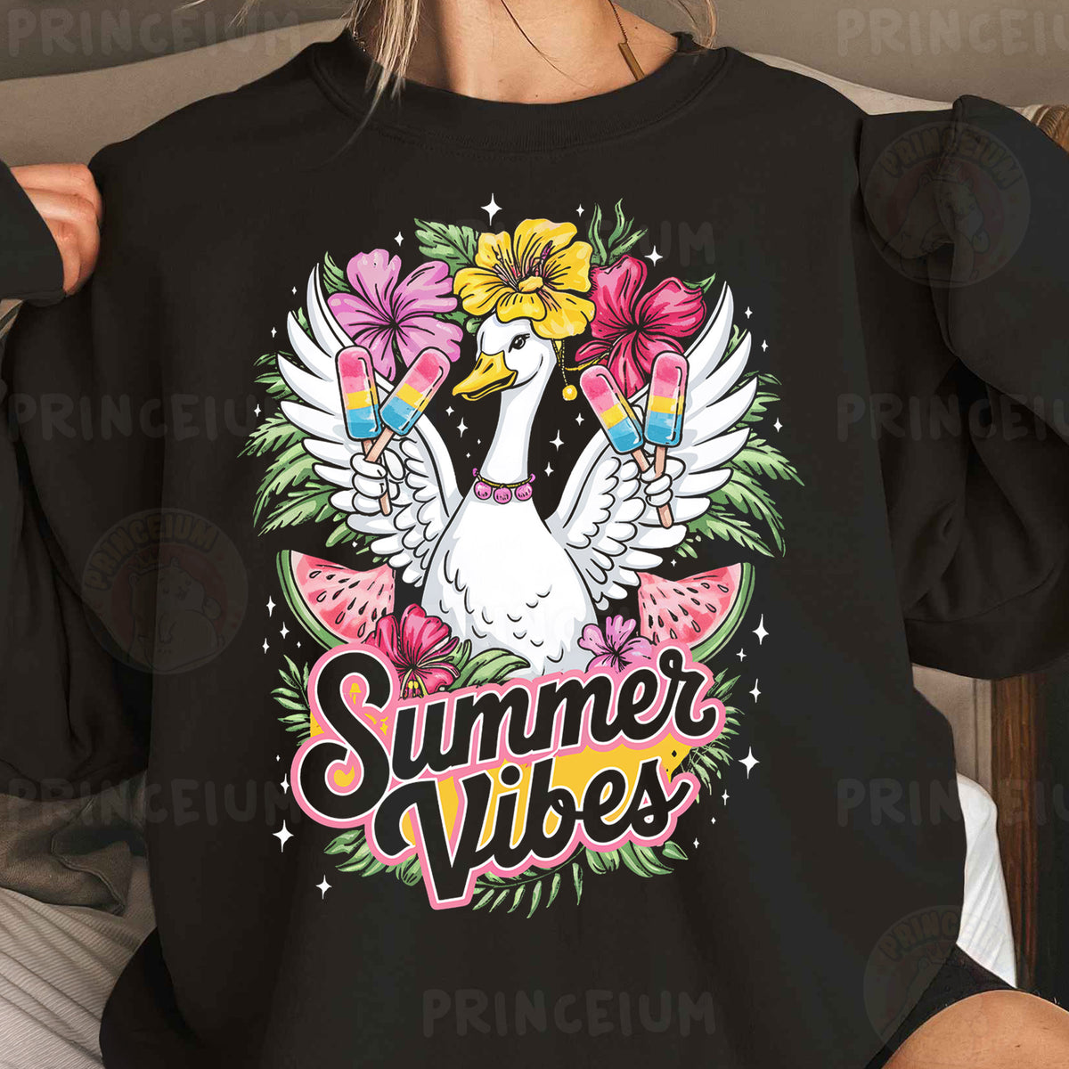 a woman wearing a black shirt with a white bird and flowers on it