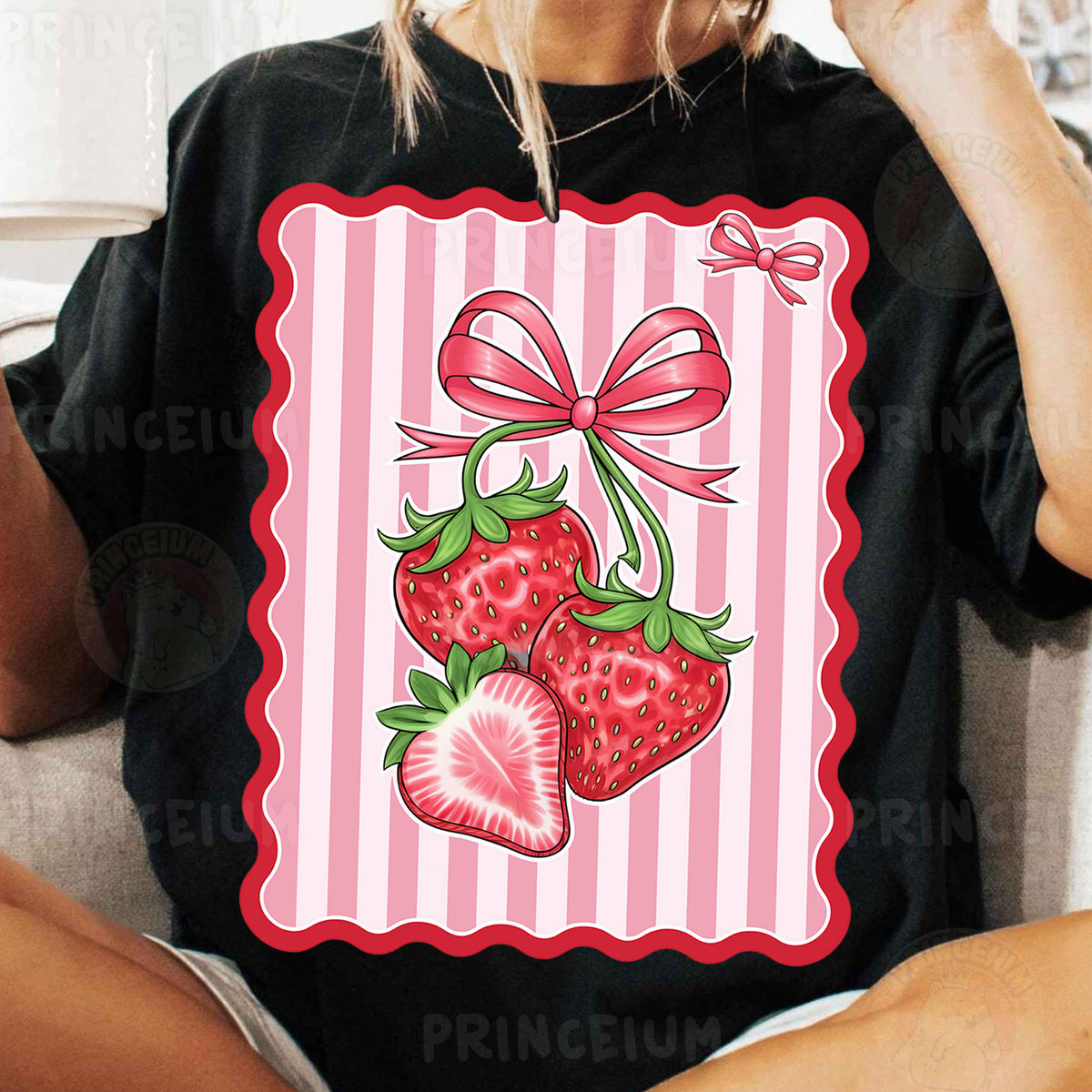 a woman sitting on a couch wearing a t - shirt with a picture of two