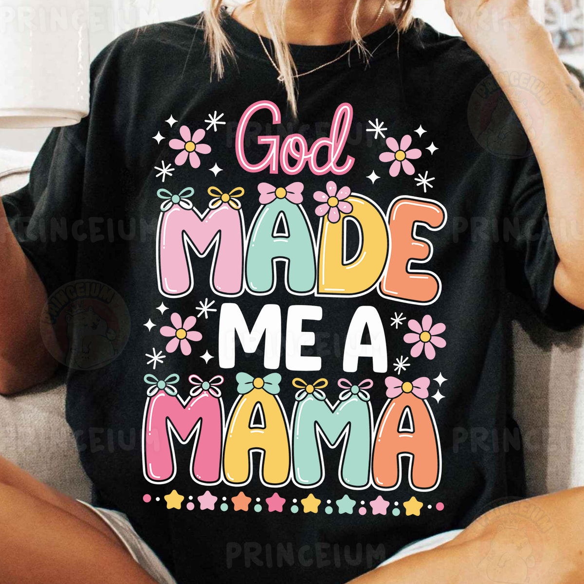 a woman sitting on a couch wearing a t - shirt that says god made me