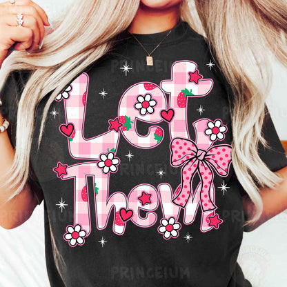 a woman wearing a black shirt that says let them know