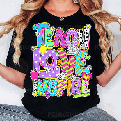 a woman wearing a t - shirt that says teach love inspire