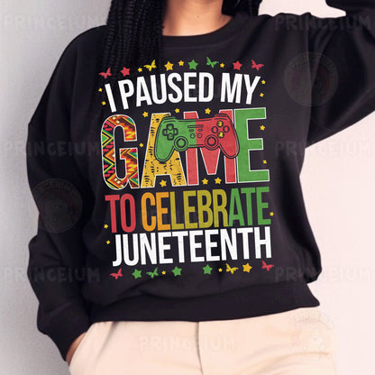a woman wearing a black sweatshirt that says i paused my game to celebrate junetee