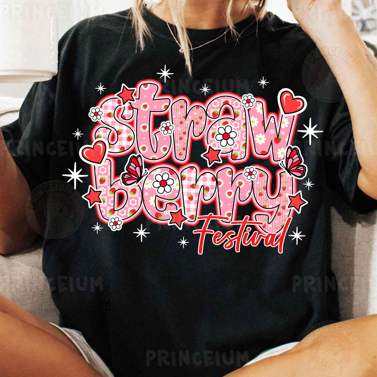 a woman sitting on a couch wearing a black t - shirt with the words straw