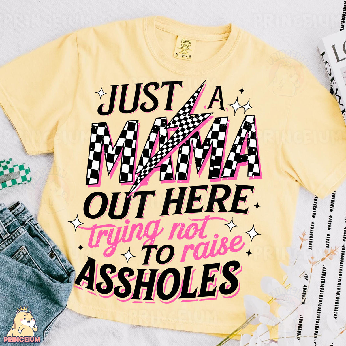 a t - shirt that says just a mama out here trying to raise asholes
