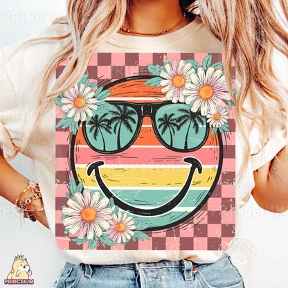 a woman wearing a t - shirt with a smiley face wearing sunglasses