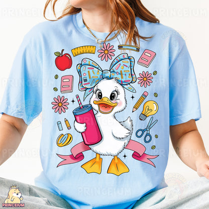 a girl wearing a blue shirt with a duck on it