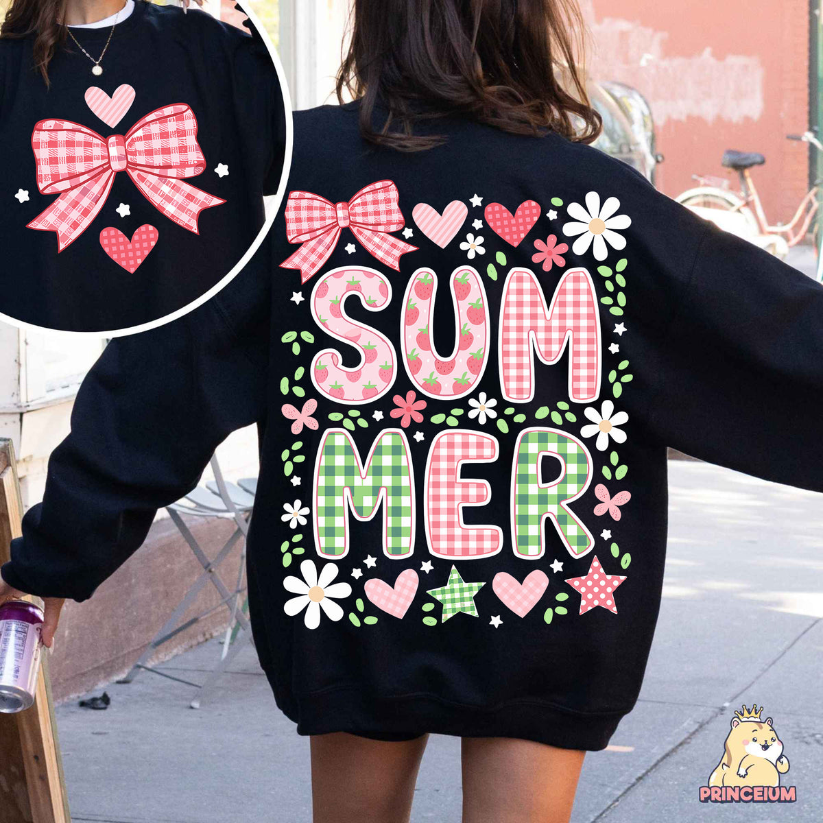 a woman walking down a street wearing a black sweatshirt