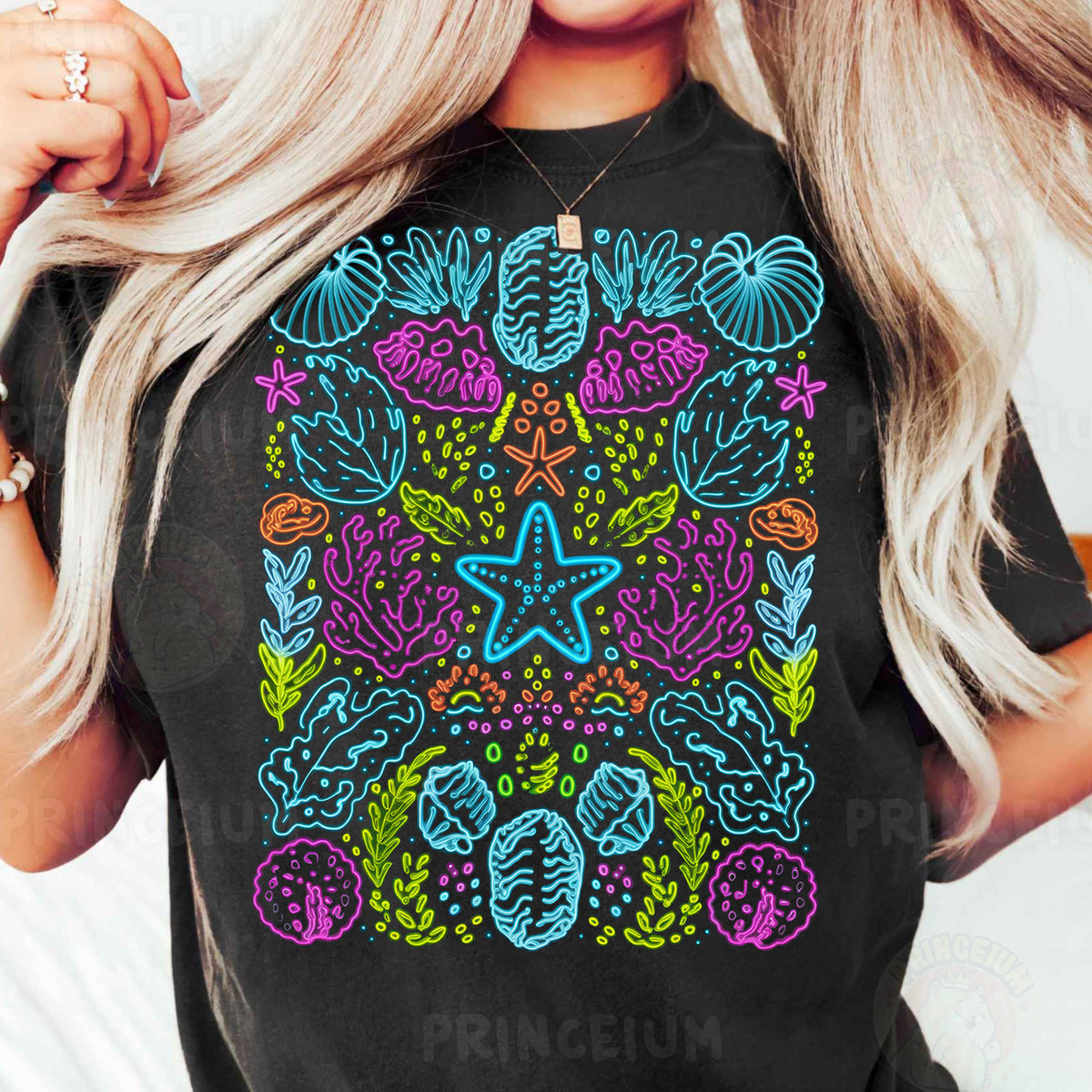 a woman wearing a black t - shirt with a colorful design on it