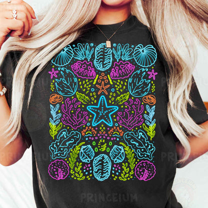 a woman wearing a black t - shirt with a colorful design on it