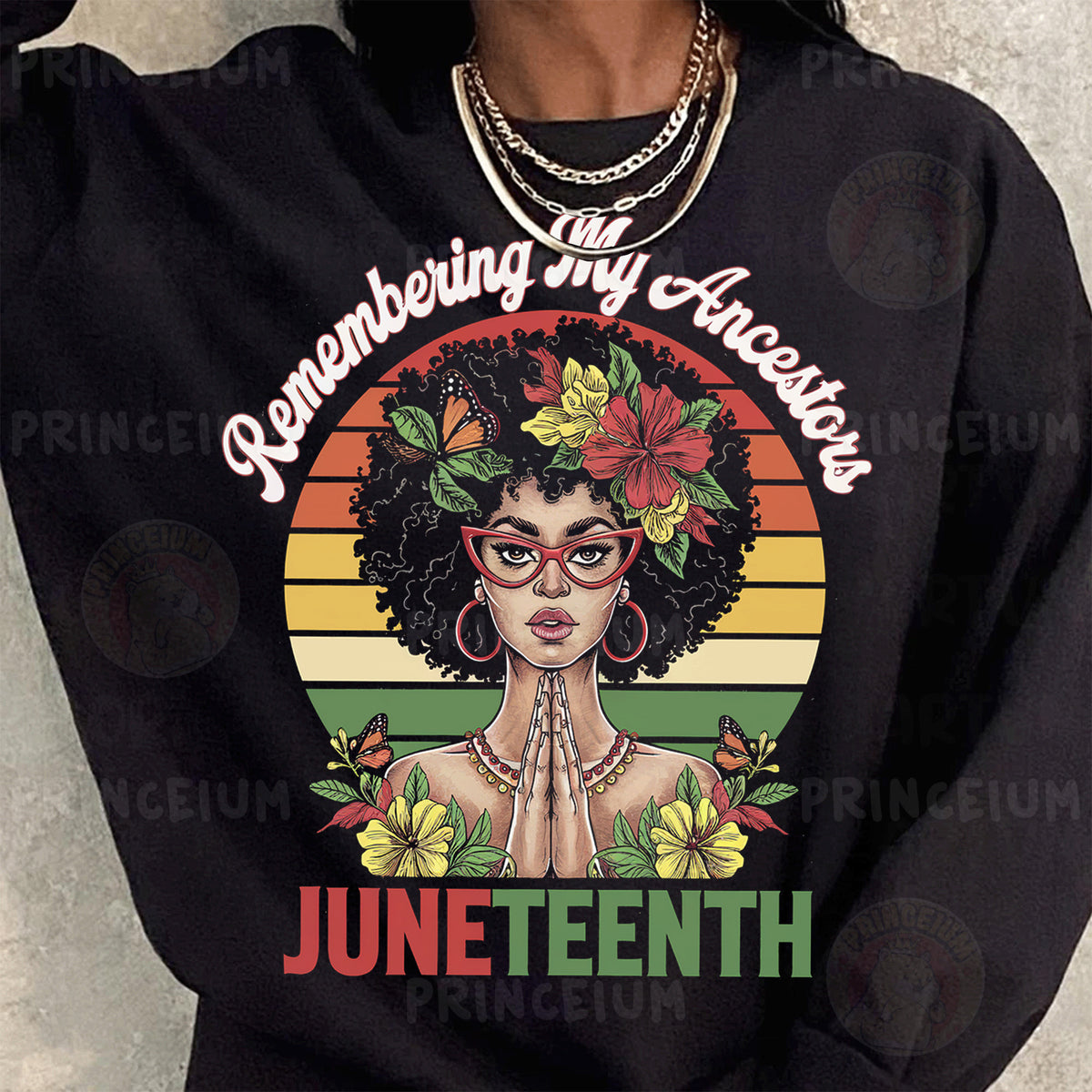 a woman wearing a black shirt that says juneteeth