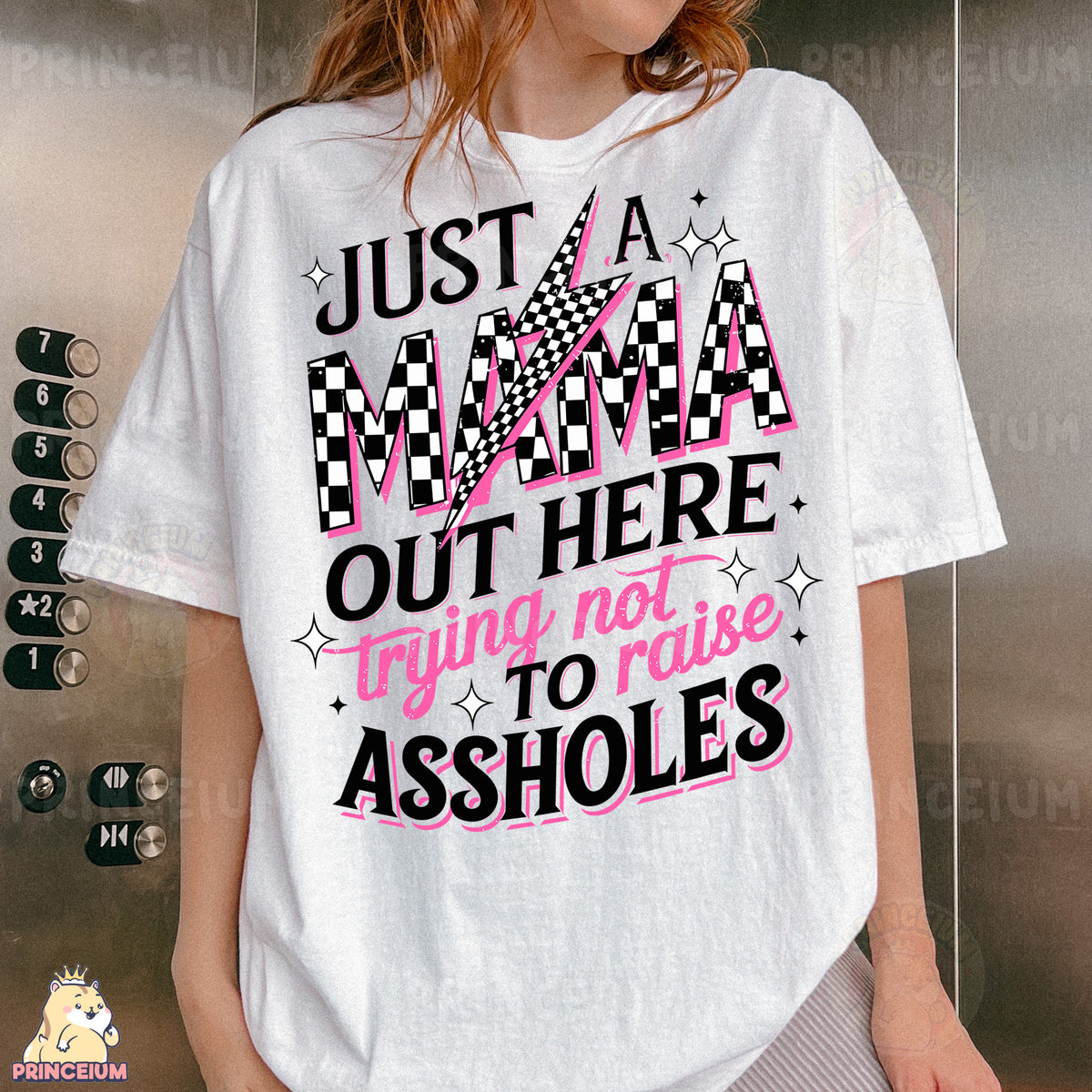 a woman wearing a t - shirt that says just a mama out here trying to
