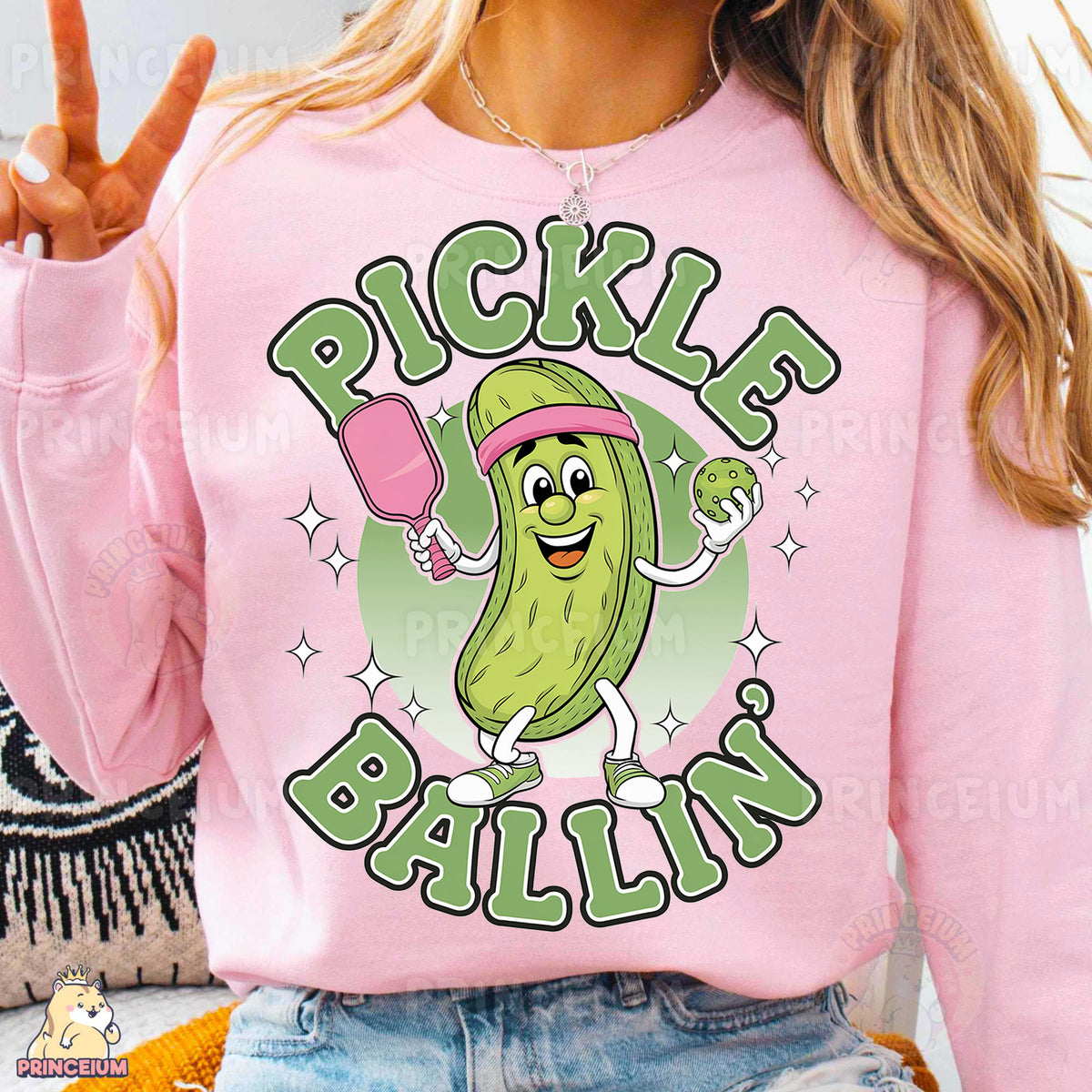 a woman wearing a pink pickle ballin shirt