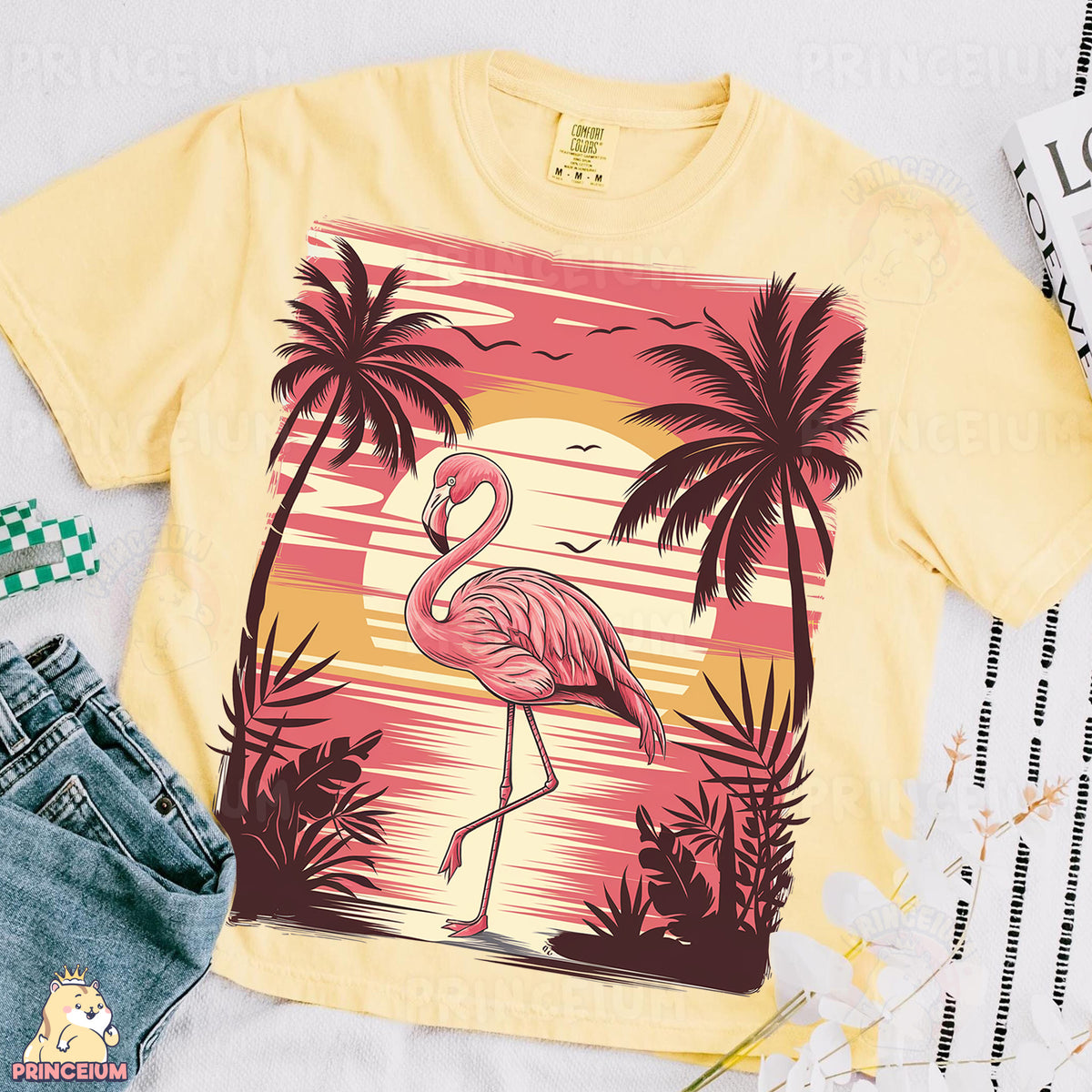 a yellow shirt with a pink flamingo on it