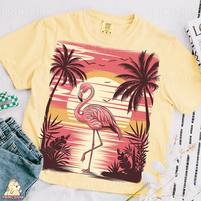a yellow shirt with a pink flamingo on it