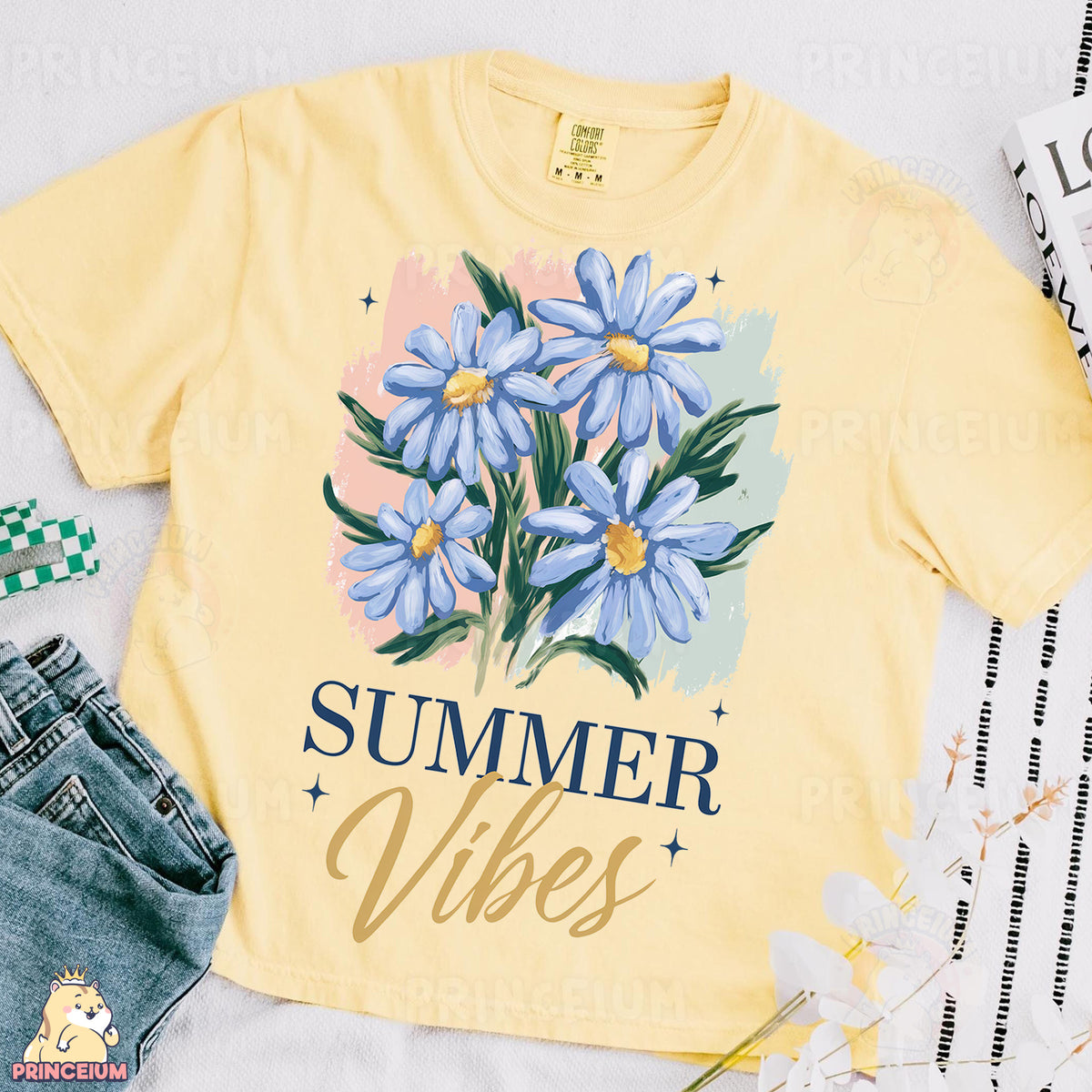 a yellow shirt with blue flowers on it