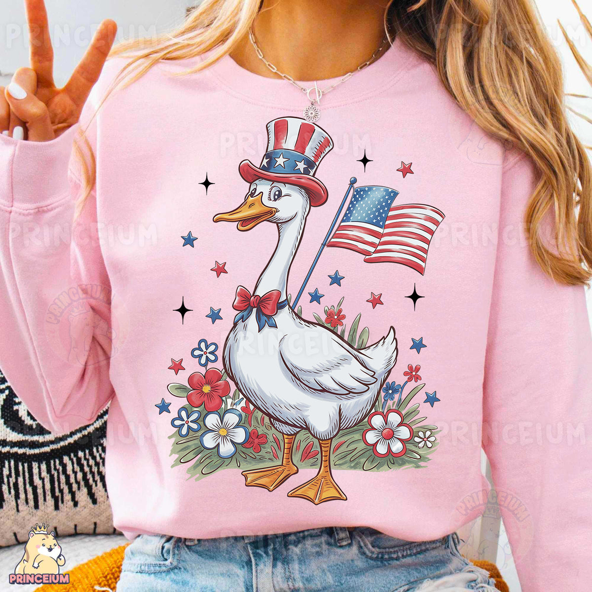 a woman wearing a pink sweater with a patriotic duck on it