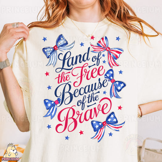 a woman wearing a t - shirt with the words land of the free because of