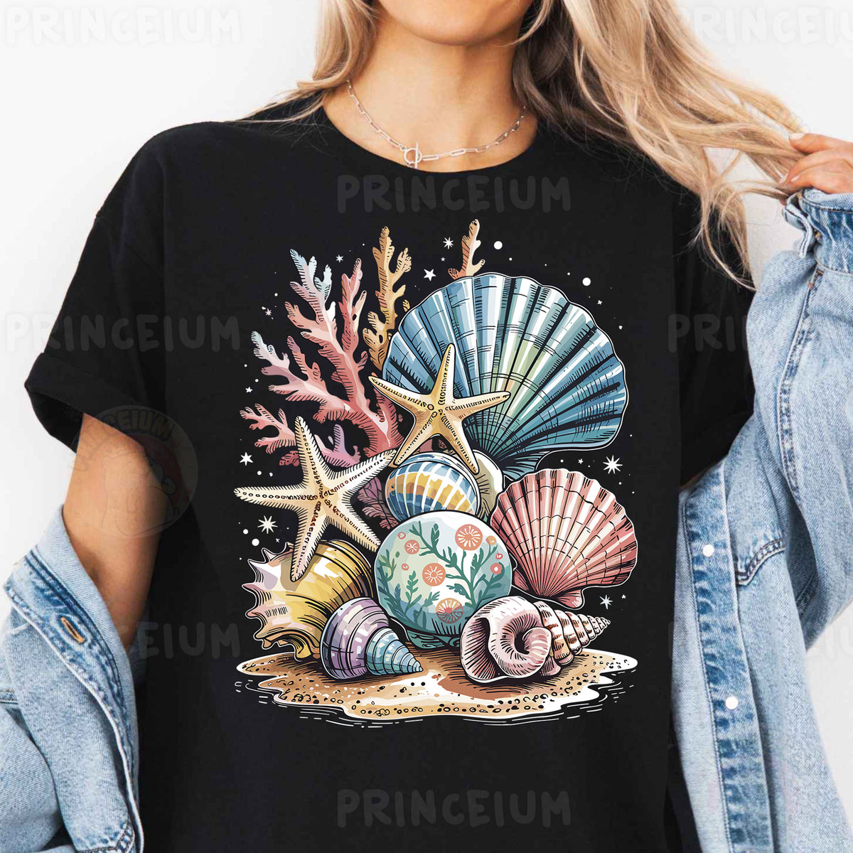 a woman wearing a black t - shirt with seashells and starfish on