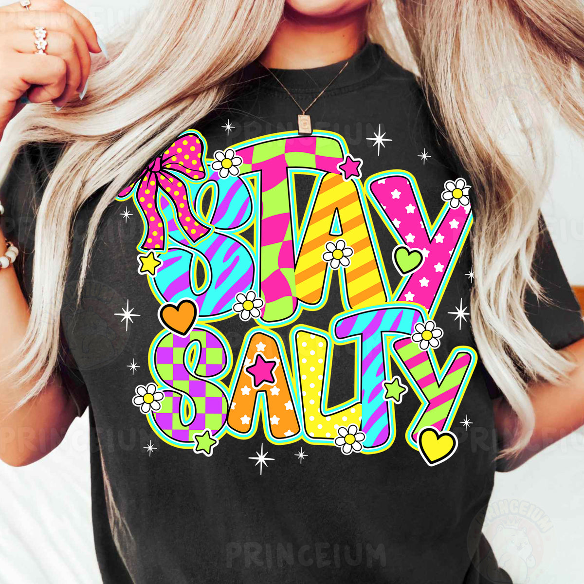 a woman wearing a t - shirt that says stay salty