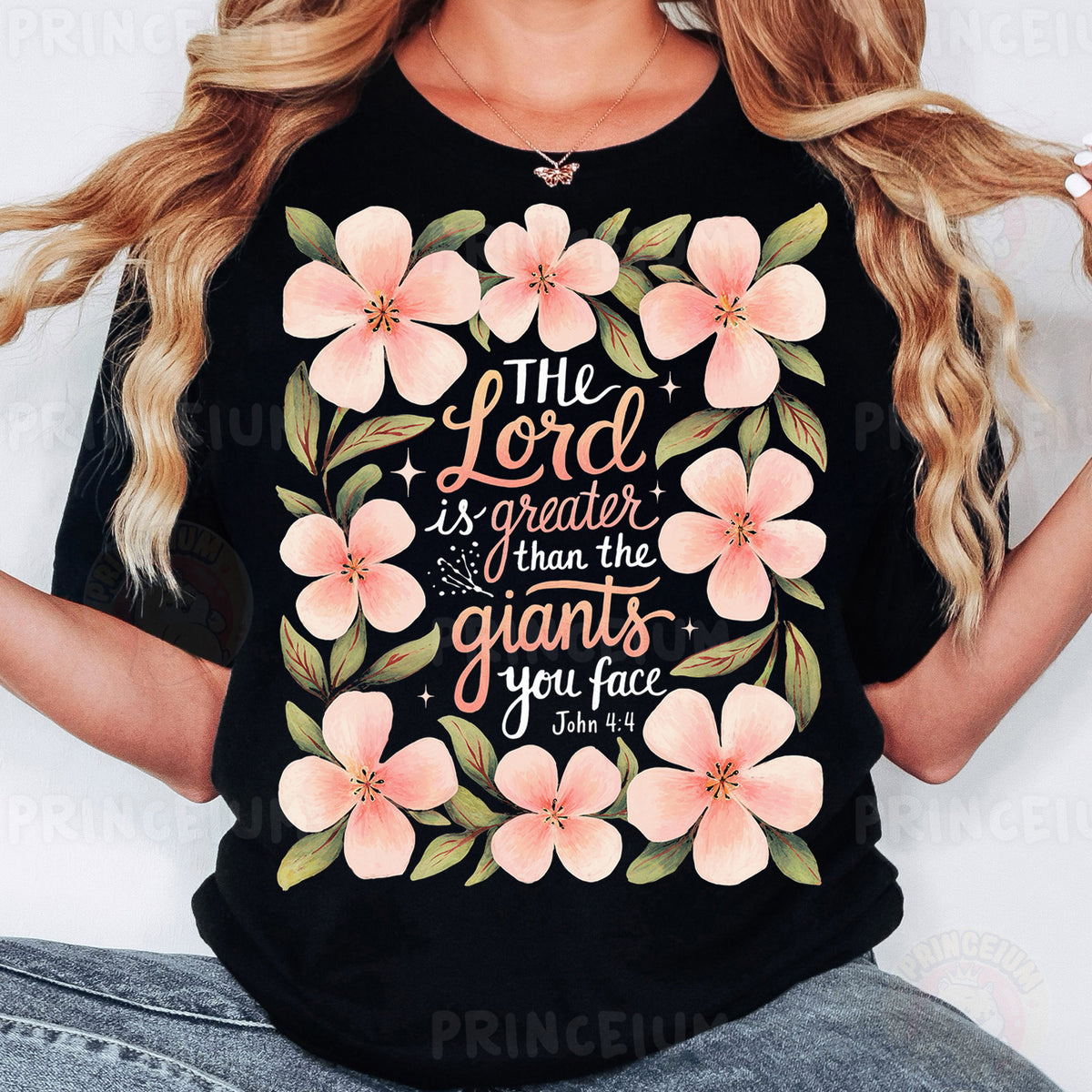 a woman wearing a black shirt with pink flowers on it