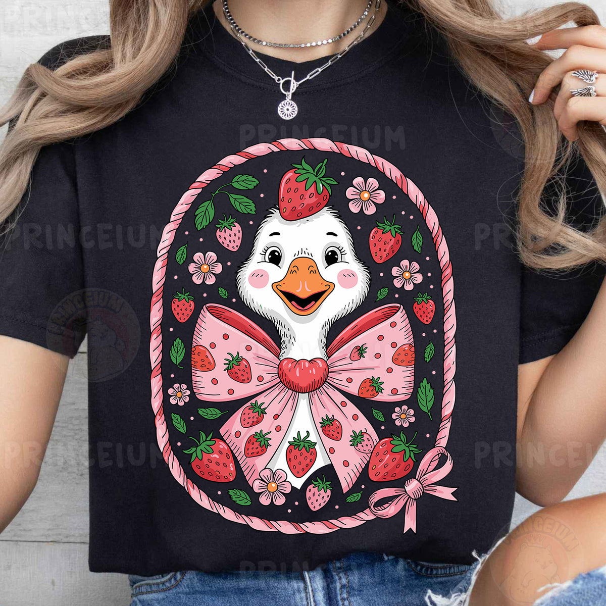 a woman wearing a t - shirt with a duck wearing a bow and strawberries