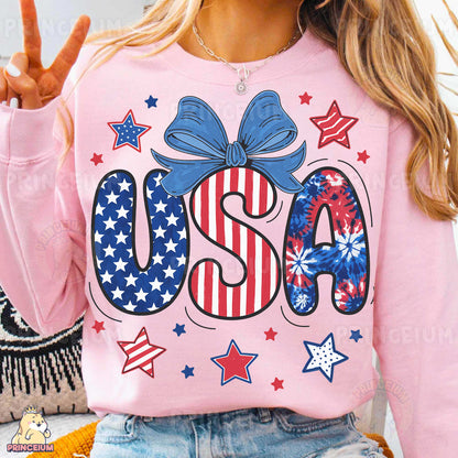 a woman wearing a pink usa sweatshirt with stars and stripes