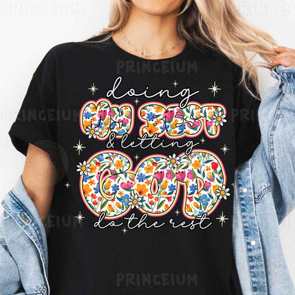 a woman wearing a black t - shirt with a floral design