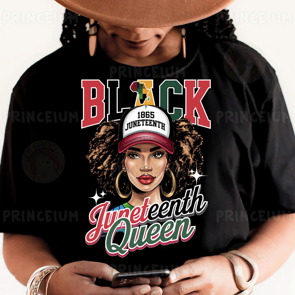 a woman wearing a black shirt and a hat holding a cell phone