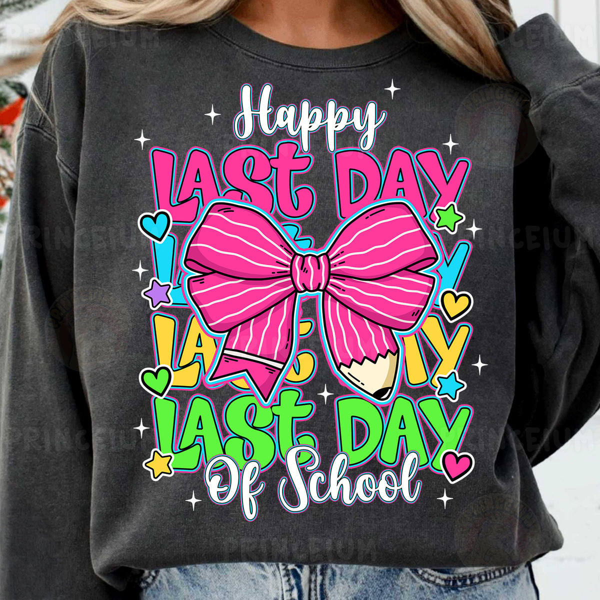 a woman wearing a black sweatshirt with a pink bow