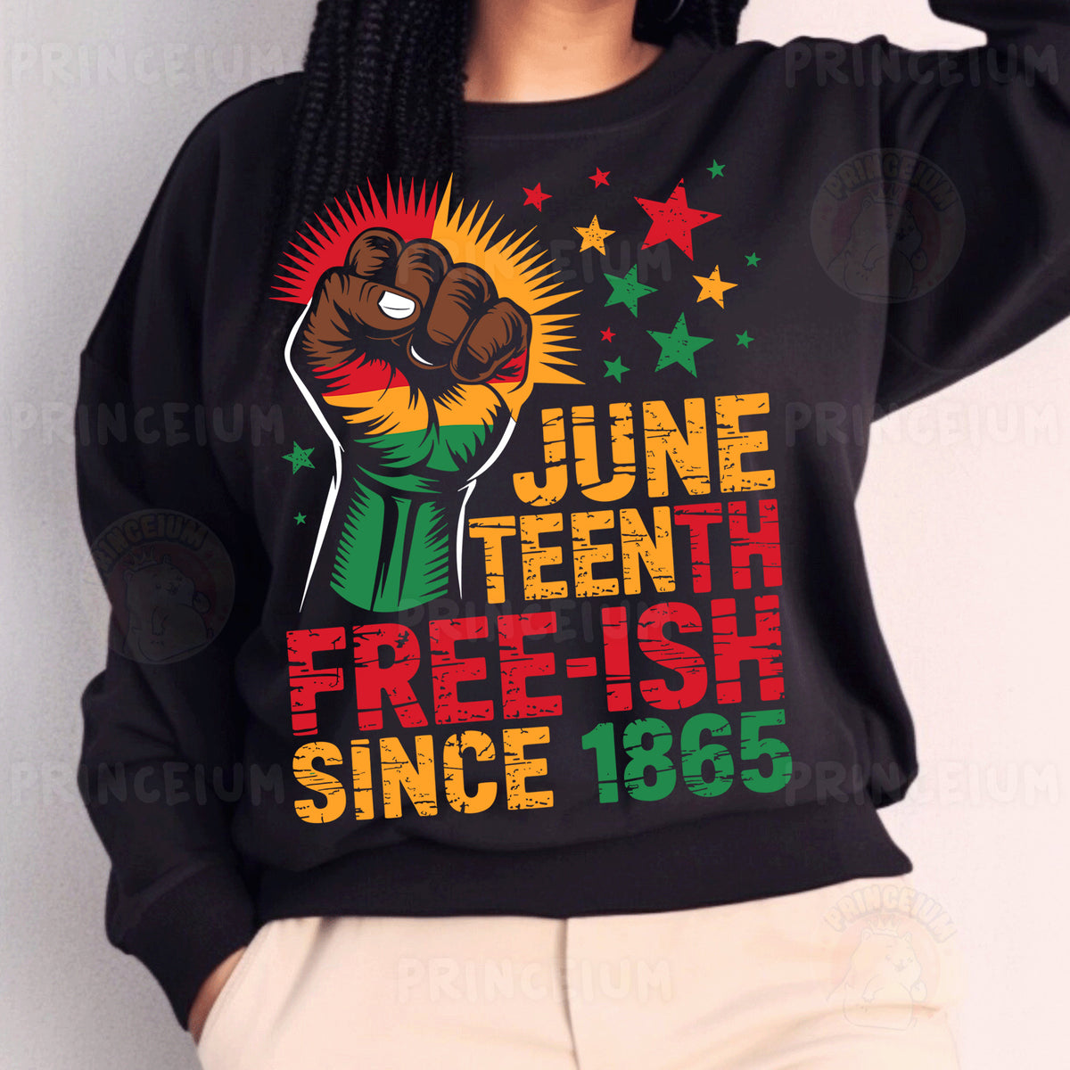 a woman wearing a black sweatshirt with a fist on it