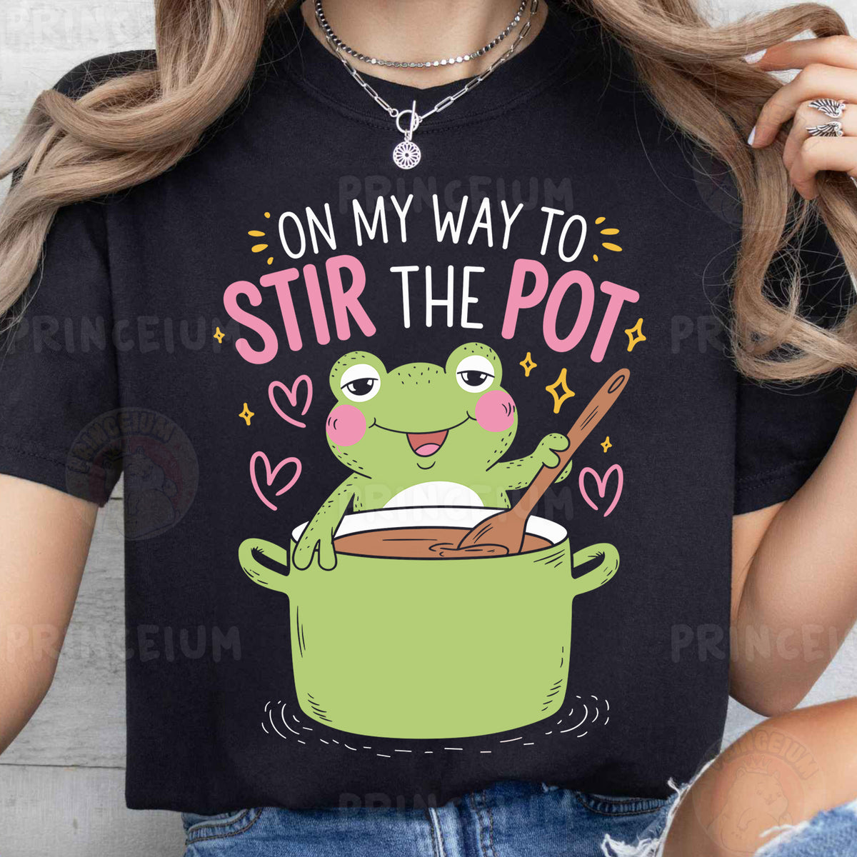 a woman wearing a t - shirt that says on my way to stir the pot