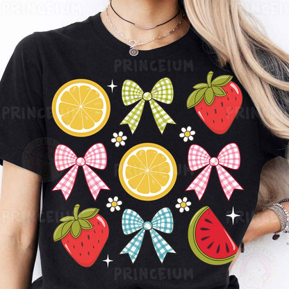 a woman wearing a t - shirt with fruit and bows on it
