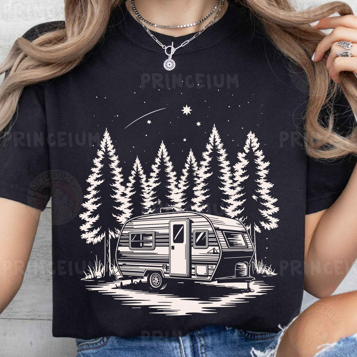 a woman wearing a black shirt with a camper on it
