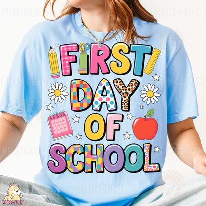 a girl wearing a t - shirt that says first day of school