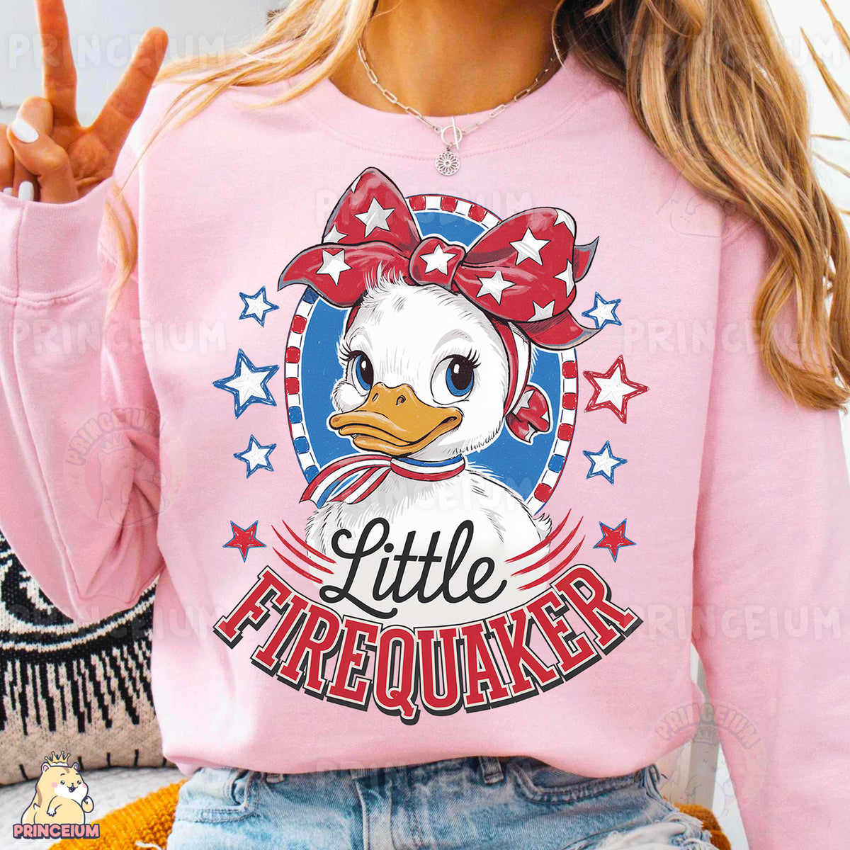 a woman wearing a pink shirt with a duck on it