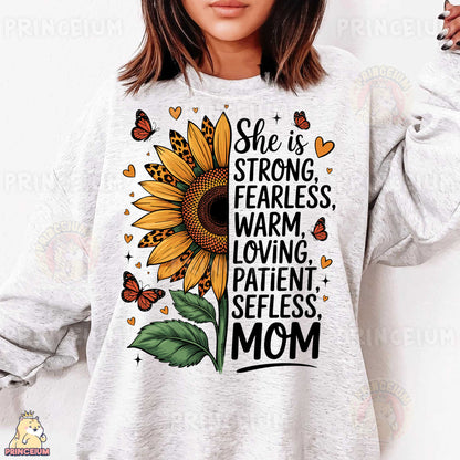 a woman wearing a sweatshirt that says she is strong, fearless, warm, loving