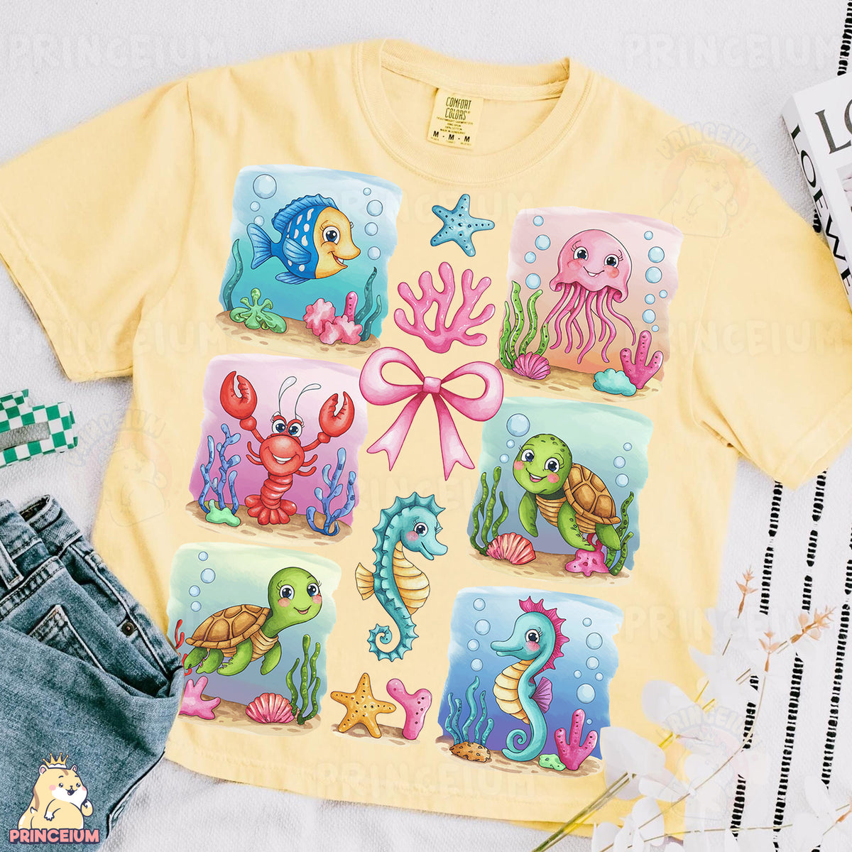 a yellow shirt with sea animals on it