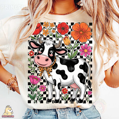 a woman wearing a t - shirt with a cow on it