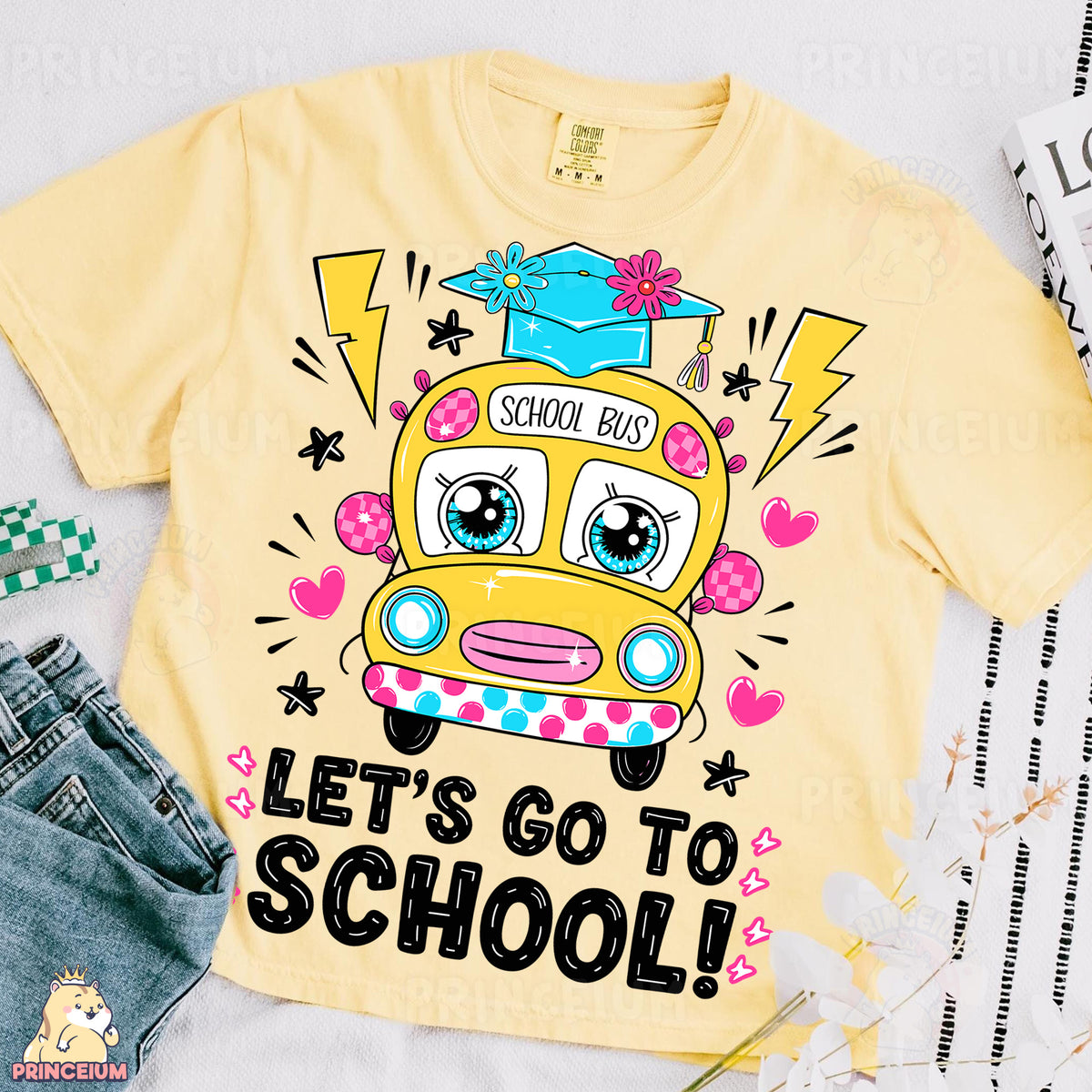 a yellow shirt with a school bus on it